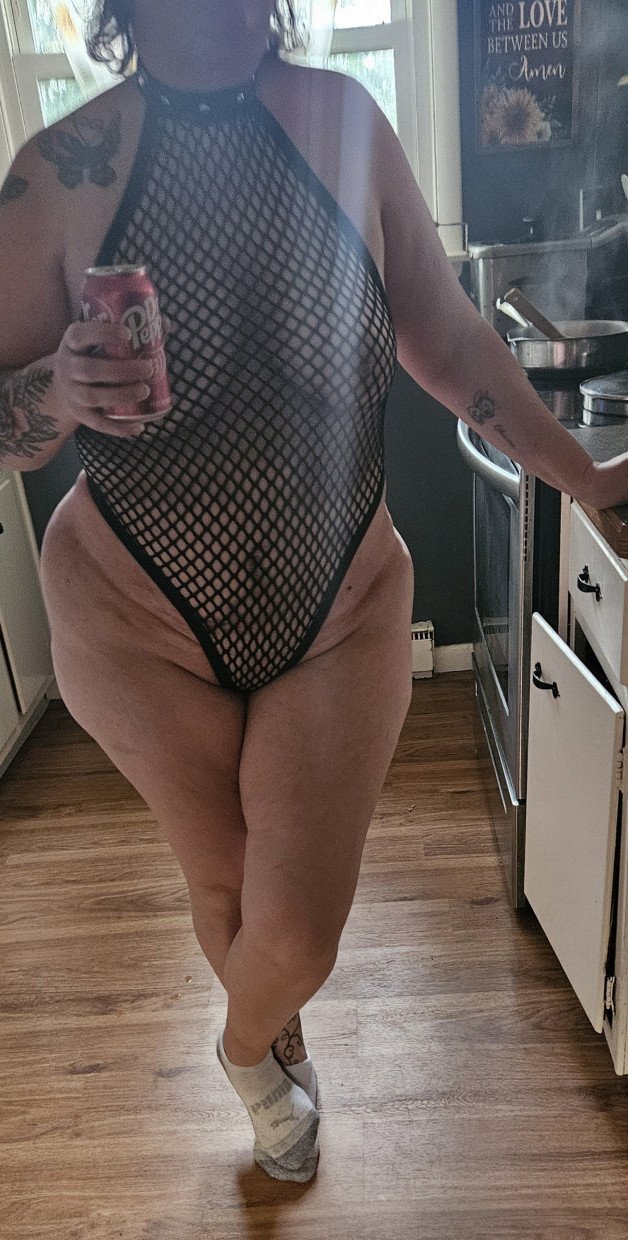 Album by BothWaysEntwined with the username @BothWaysEntwined, who is a verified user,  May 2, 2024 at 11:31 PM and the text says 'Her turn to cook "mostly" naked. Damn she's sexy!!  🔥🔥🤤🔥🔥 We need one of our Big Dick followers to come fuck us 🍆💦💦🍑🍑 #hotwife #bisexual #amateur #nude'