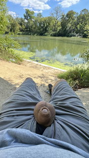 Photo by Xtraskin with the username @Xtraskin, who is a verified user,  September 27, 2024 at 7:58 PM. The post is about the topic NakedInNature and the text says 'Hanging out by the river!'