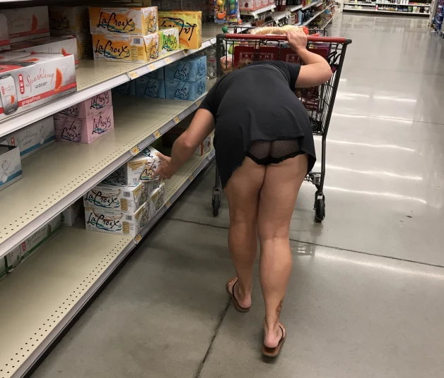Photo by Foxywifey1975 with the username @Foxywifey1975, who is a verified user,  April 7, 2024 at 10:21 PM. The post is about the topic Flashing in Public and the text says 'Grocery shopping. This dress might be a little short. Wonder if anyone else got a peak?'
