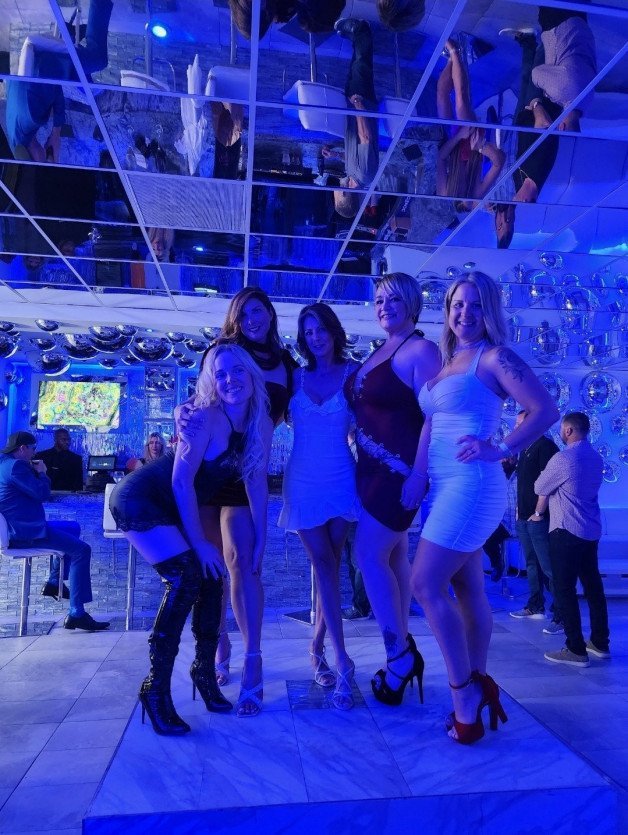 Photo by Dragontalez with the username @Dragontalez, who is a verified user,  April 24, 2024 at 9:29 PM and the text says 'Good times in Florida. Great group of ladies and we all had some fun! My wife is in the red dress, to the right of Kitty Kristy'
