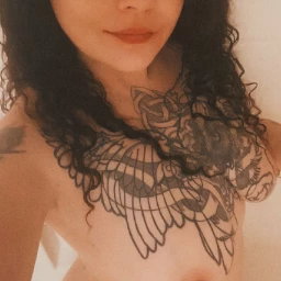 Shared Photo by PrettyTatted with the username @PrettyTatted, who is a verified user,  April 11, 2024 at 4:22 PM and the text says 'my gorgeous wife @PrettyTatted'