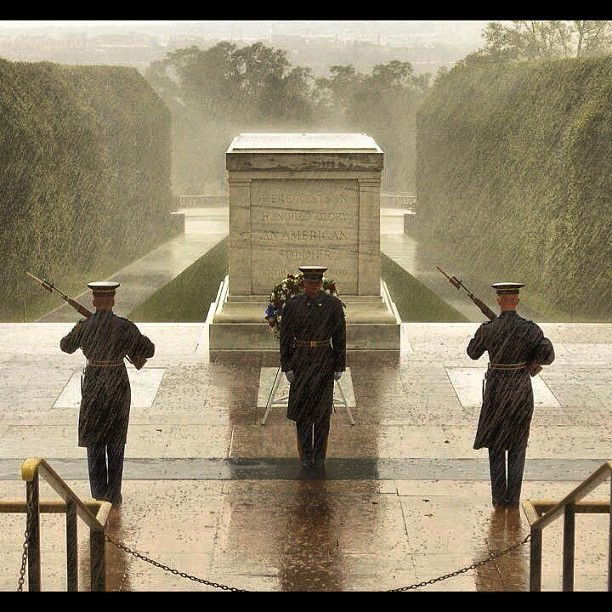 Photo by Ron with the username @rft161355,  August 30, 2016 at 12:35 AM and the text says 'currentlycurrentnews:

Despite the current weather conditions, soldiers are still PROUDLY guarding the Tomb of the Unknown Soldier. This tomb has been continuously guarded since 1948. That is true loyalty and pride for your country'