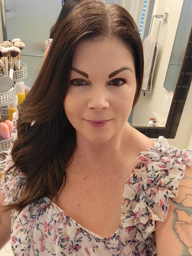 Photo by Hottmom76 with the username @Hottmom76, who is a verified user,  July 26, 2024 at 5:41 AM. The post is about the topic MILF and the text says 'Am I still hot with clothes on? 😉'