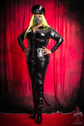 Photo by Dirk Hooper with the username @DirkHooper, who is a verified user,  May 28, 2024 at 10:40 PM and the text says 'Mistress Mia Darque, the Oklahoma Amazon is in Los Angeles. The 6'3" Dominatrix has arrived for DomCon Los Angeles, Erotic City at LA Pride and will be available for appointments at Sanctuary Studios.

Mistress Mia Darque in Los Angeles for DomCon, LA..'