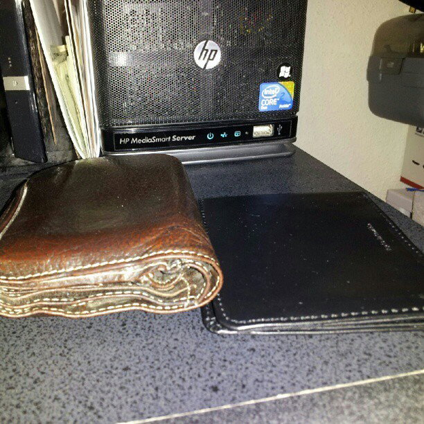 Photo by Jadehawk with the username @Jadehawk,  June 19, 2012 at 2:03 AM and the text says 'Picture of both empty wallets. (Taken with Instagram)'