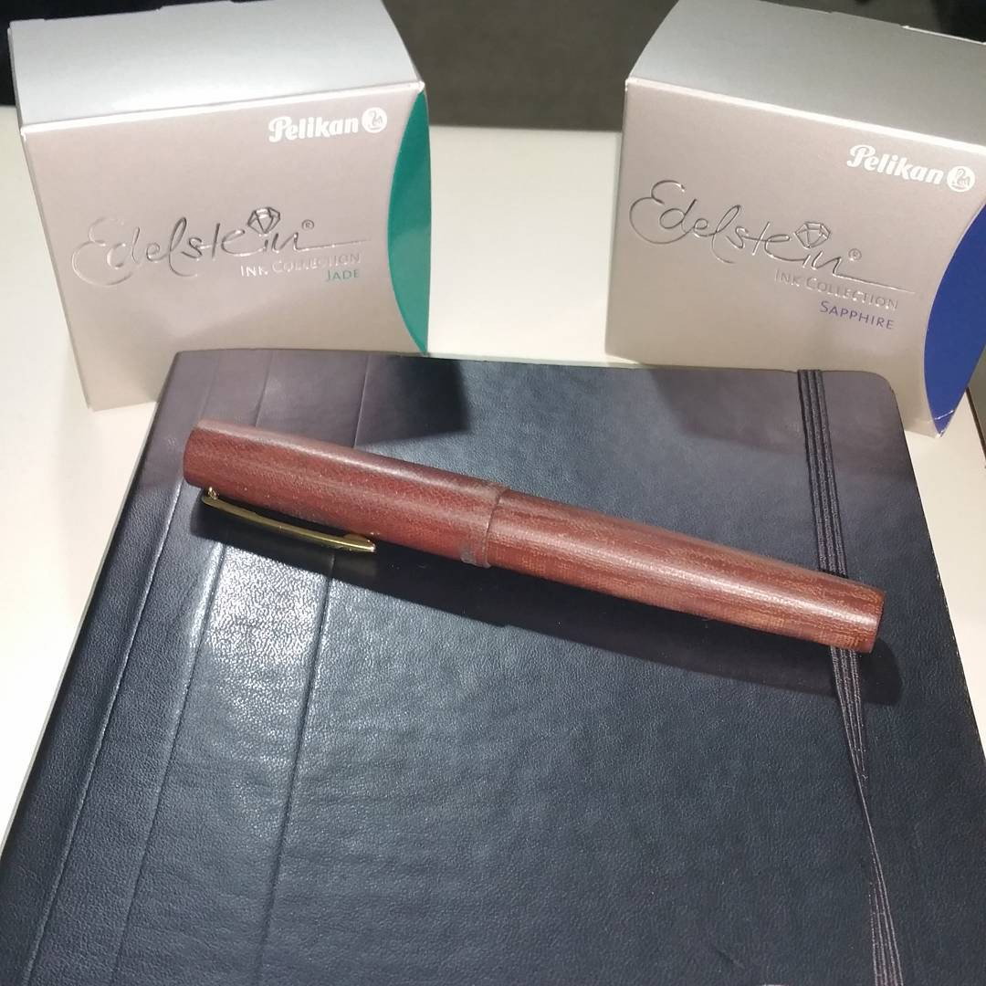 Photo by Jadehawk with the username @Jadehawk,  July 10, 2015 at 10:41 PM and the text says 'Latest addition #TWISBI #MICARTA 805 And 2 bottles of #Pelikan #Edelstein Ink (#Jade &amp; #Sapphire) #twisbi  #micarta  #edelstein  #sapphire  #pelikan  #jade'