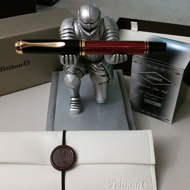 Photo by Jadehawk with the username @Jadehawk,  May 30, 2015 at 10:32 PM and the text says 'Latest arrival #Pelikan M400 with M nib.  And a bottle of  #Diamine ink &ldquo;Syrah&rdquo; #pelikan  #diamine'