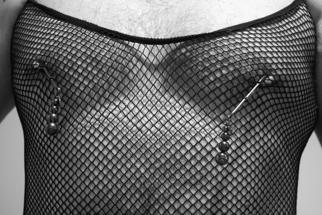 Photo by Spike50Kinky with the username @Spike50Kinky, who is a verified user,  June 12, 2021 at 7:30 AM and the text says 'Here's the nipple clamps

#fishnet #fishnetbodystocking #nipple_clamps #me'