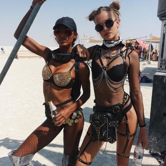 Album by Devynsdogg with the username @Devynsdogg,  March 6, 2021 at 9:59 PM. The post is about the topic Festival Sluts and the text says 'Burner Girls!  Whether it's the tall, slim and very sexy bodies, the Mad Max style costumes, elaborate hair styles, boots, the music or whatever.... #blondesarebeautiful #sexyfemales #babes #sexyboots #beautyofthefemaleform #fetish #giwtf #tattoo'