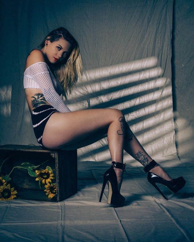 Watch the Photo by Devynsdogg with the username @Devynsdogg, posted on August 25, 2021. The post is about the topic Girls with High Heels. and the text says 'Those are some HOT heels!  #blondesarebeautiful #platformheels #babes #sexyfemales #tattoo #stripper'