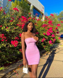 Photo by Devynsdogg with the username @Devynsdogg,  October 29, 2020 at 11:25 PM. The post is about the topic Black Beauties and the text says 'How does that dress stay up?  Two GOOD reasons! lol #blackgirls #ebony #hourglassfigures #babes #sexyfemales #shortskirts #tightdresses #girlsyoudreamof #beautyofthefemaleform'