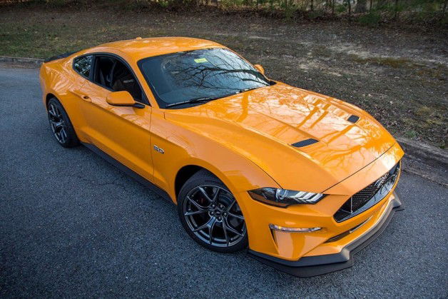 Photo by GoMakeIt with the username @GoMakeIt,  September 27, 2018 at 9:21 PM and the text says 'thunderandthrottle:

2018 Mustang GT Performance Pack Level 2
Orange Fury

My dream car'