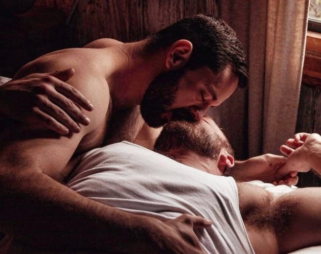 Photo by Nickplus33 with the username @Nickplus33, who is a verified user,  May 2, 2024 at 3:10 AM and the text says '#bromance #dilf #beard #kissing'