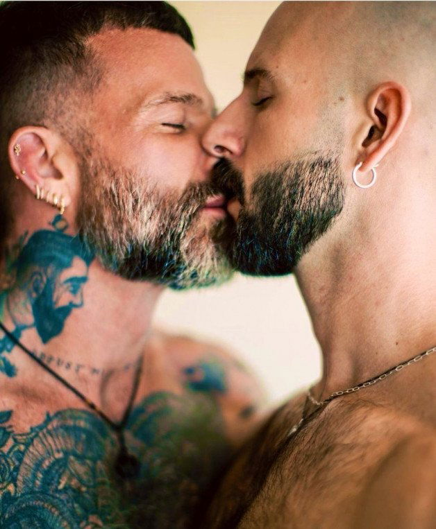 Photo by Nickplus33 with the username @Nickplus33, who is a verified user,  February 8, 2024 at 3:19 AM and the text says '#bromance #kissing #dilf #hairy #beard #chain #ink'