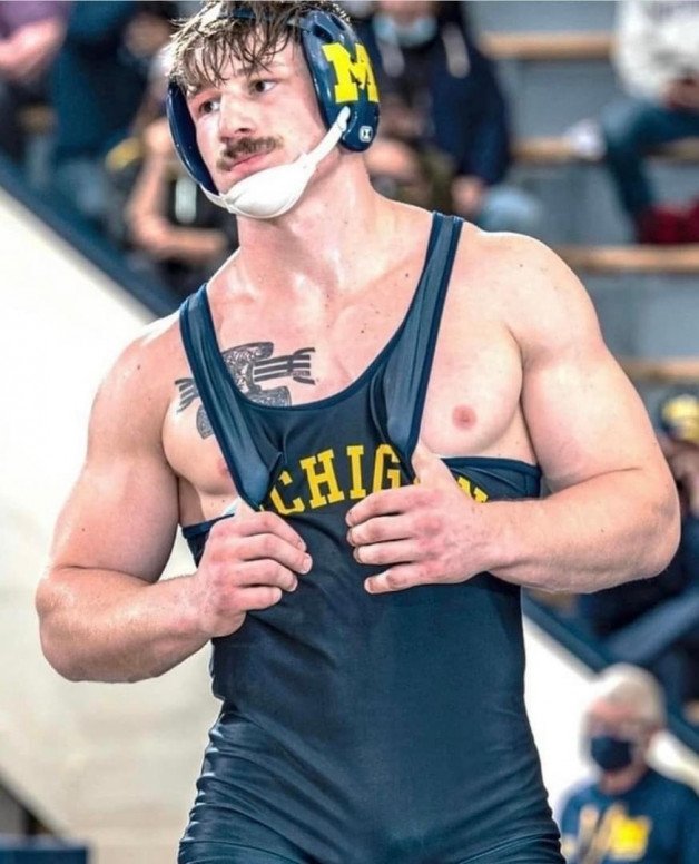 Photo by Nickplus33 with the username @Nickplus33, who is a verified user,  May 30, 2024 at 2:16 AM and the text says '#stache #muscled #youngdilf #wrestler'