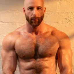 Photo by Nickplus33 with the username @Nickplus33, who is a verified user,  May 3, 2024 at 3:15 AM and the text says '#muscled #hairy #hairychest #beard #bald #dilf'