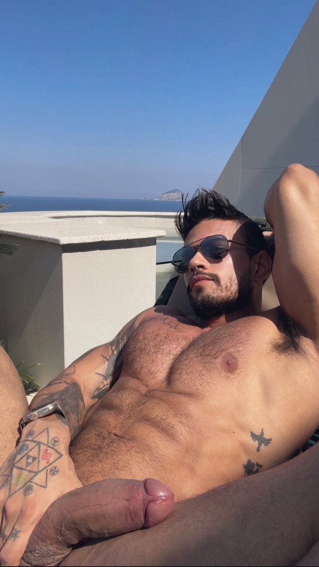 Watch the Photo by Nickplus33 with the username @Nickplus33, who is a verified user, posted on March 6, 2024 and the text says '#shades #hairy #ink #beard #shades #manspread  #muscled #hung #thickdick #ink #otter  #trimmed  #beard'