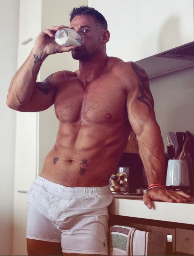 Photo by Nickplus33 with the username @Nickplus33, who is a verified user,  January 6, 2024 at 6:02 AM and the text says '#muscled #dilf #boxers #scruff #ink'