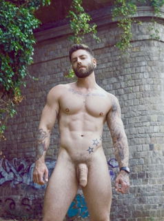 Photo by Nickplus33 with the username @Nickplus33, who is a verified user,  October 29, 2023 at 4:40 AM and the text says '#muscled #beard #ink #hung #thickdick #chain #uncut'