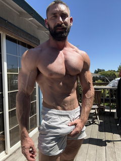 Photo by Nickplus33 with the username @Nickplus33, who is a verified user,  July 2, 2024 at 2:01 AM and the text says '#muscled #dilf #beard #bulge #outdoors'