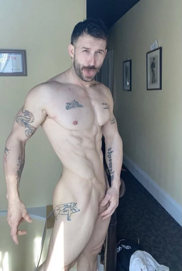 Photo by Nickplus33 with the username @Nickplus33, who is a verified user,  May 2, 2024 at 3:05 AM and the text says '#nicolasryder #tongue #obsession #ink #trimmed  #scruff  #youngdilf'