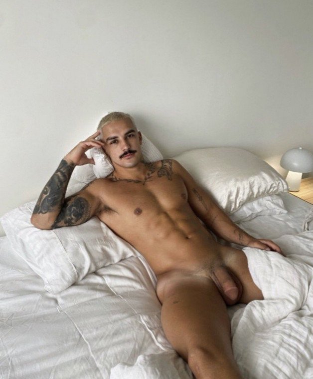Photo by Nickplus33 with the username @Nickplus33, who is a verified user,  March 14, 2024 at 2:52 AM and the text says '#smooth #muscled #tanned #ink #hung #trimmed  #stache #stud'