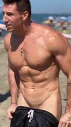 Photo by Nickplus33 with the username @Nickplus33, who is a verified user,  January 24, 2024 at 3:32 AM and the text says '#gifs #muscled #outdoors #chain #smooth #uncut #youngdilf beach'