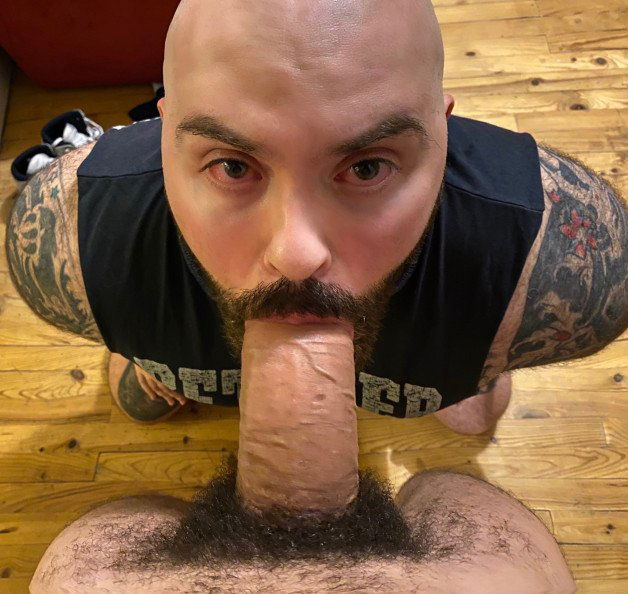 Photo by Nickplus33 with the username @Nickplus33, who is a verified user,  July 4, 2024 at 3:11 AM and the text says '#ink #bald #hung #cocksucking #BJ #facefuck #beard #thickbush #beercandick #fatcock #thickdick #ink #monstercock #massivecock'