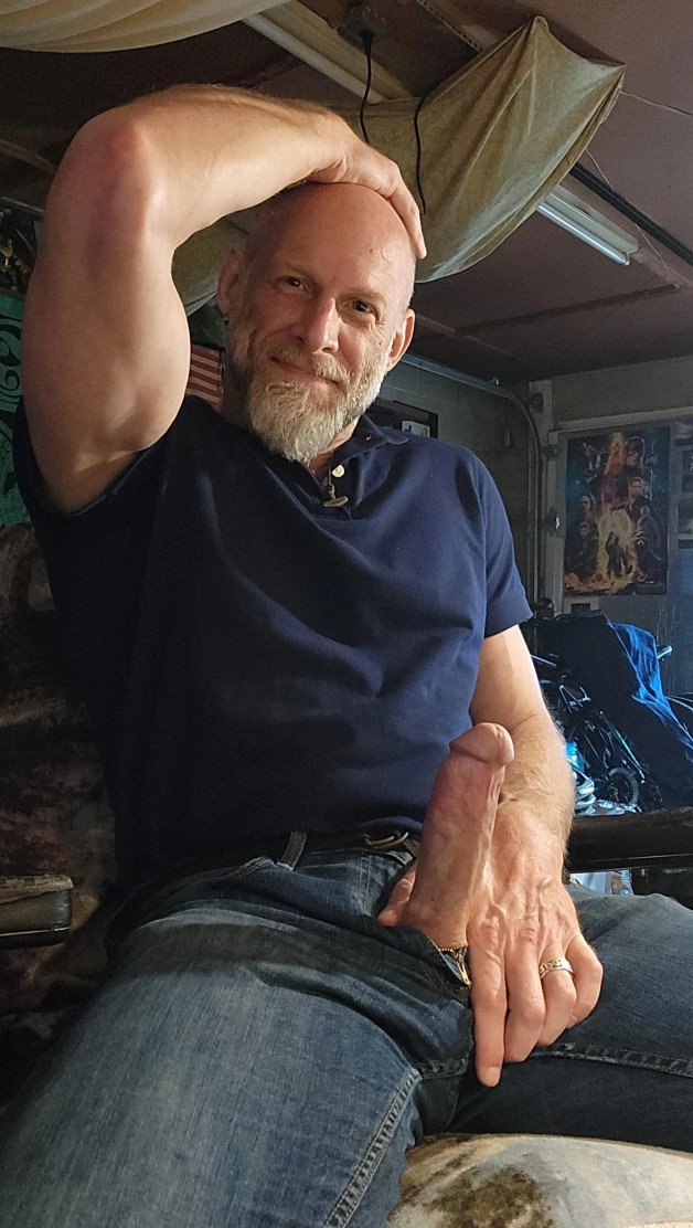 Photo by Nickplus33 with the username @Nickplus33, who is a verified user,  January 19, 2024 at 10:15 AM and the text says '#daddy #bald #beard #reveal #jeans #band #spear'