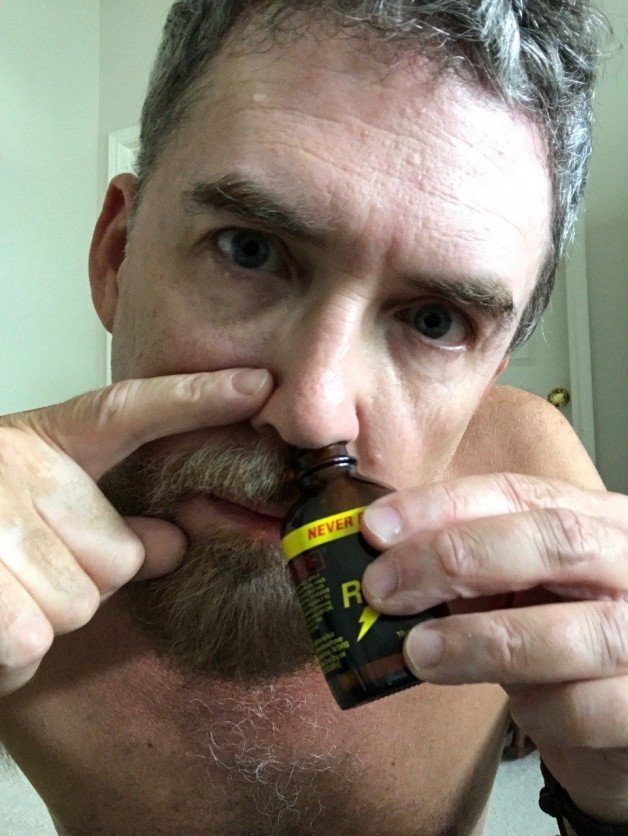 Photo by Nickplus33 with the username @Nickplus33, who is a verified user,  January 3, 2024 at 8:06 AM and the text says '#daddy #poppers #beard #sniffing'