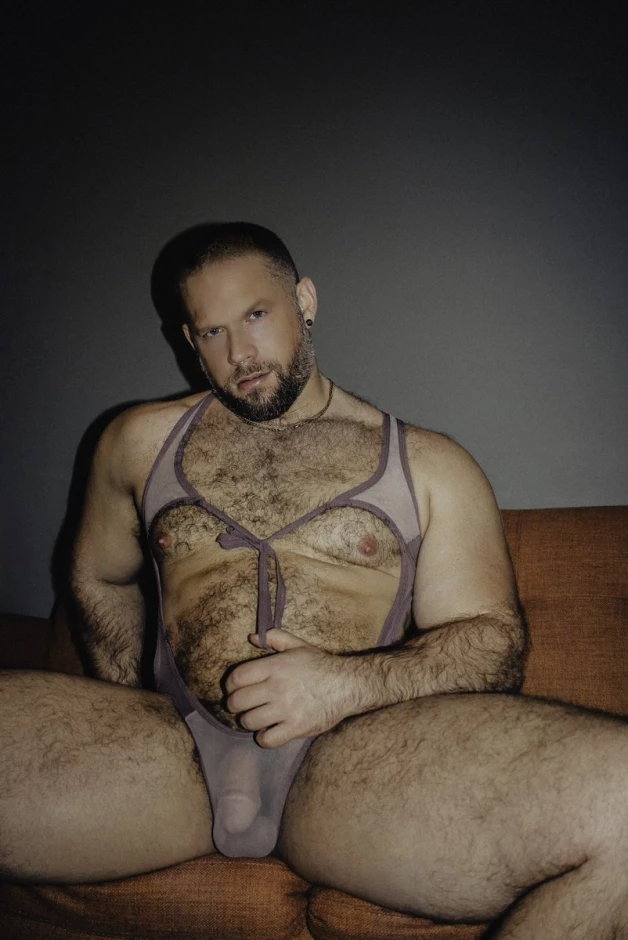 Photo by Nickplus33 with the username @Nickplus33, who is a verified user,  May 8, 2024 at 2:20 AM and the text says '#beefy #hairy #dilf #manspread  #bulge #beard #chain'
