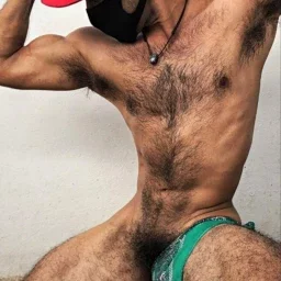 Photo by Nickplus33 with the username @Nickplus33, who is a verified user,  May 12, 2024 at 3:55 AM and the text says '#caps #hairy #thickbush #toned #chain #otter  #manspread'