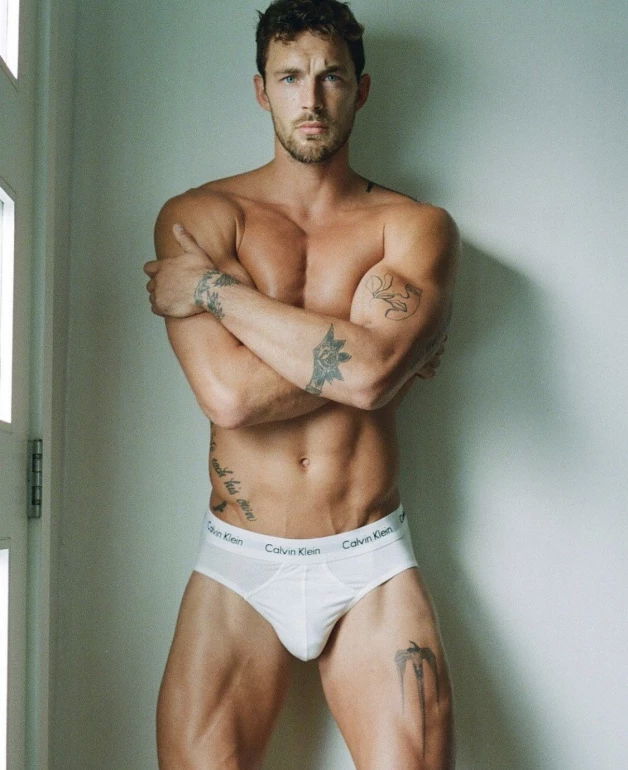 Photo by Nickplus33 with the username @Nickplus33, who is a verified user,  April 6, 2024 at 2:04 AM and the text says '#christianhogue #toned #ink #tanned #obsession #youngdilf #briefs #tightywhities'