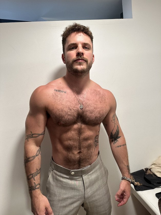 Photo by Nickplus33 with the username @Nickplus33, who is a verified user,  July 12, 2024 at 2:06 AM and the text says '#stache #toned #hairy #hairychest #ink #otter'