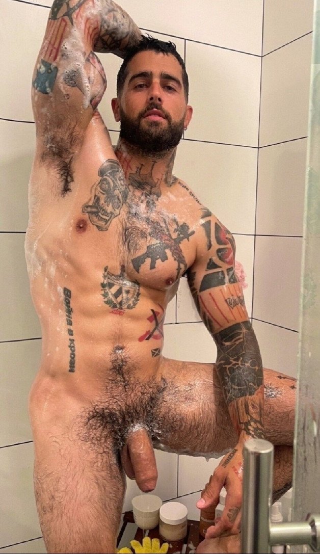 Photo by Nickplus33 with the username @Nickplus33, who is a verified user,  June 19, 2024 at 1:55 AM and the text says '#ink #shower #otter  #beard #toned #happytrail #hung #longdick #uncut  #thickdick #bush'