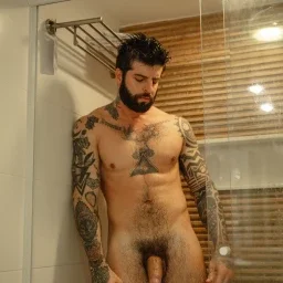 Photo by Nickplus33 with the username @Nickplus33, who is a verified user,  April 15, 2024 at 1:52 AM and the text says '#shower #beard #ink #youngdilf #hung #thickdick #uncut  #bush #thickbush'