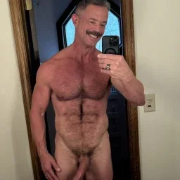 Photo by Nickplus33 with the username @Nickplus33, who is a verified user,  May 2, 2024 at 3:00 AM and the text says '#daddy #granddaddy #obsession #toned #hairy #selfie #hung #trimmed  #longdick #reecescott'