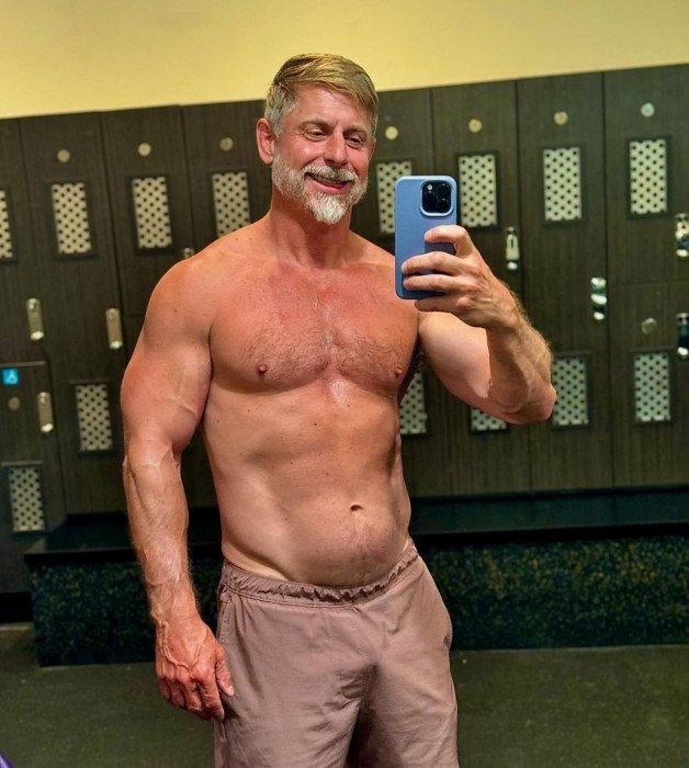 Photo by Nickplus33 with the username @Nickplus33, who is a verified user,  July 4, 2024 at 2:52 AM and the text says '#lockerroom #selfie #muscled #daddy #beard'