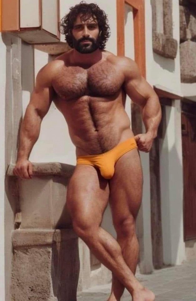 Photo by Nickplus33 with the username @Nickplus33, who is a verified user,  January 31, 2024 at 4:08 AM and the text says '#muscled #daddy #dilf #hairy #beard #bulge #speedos'