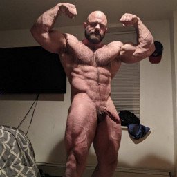 Photo by Nickplus33 with the username @Nickplus33, who is a verified user,  October 9, 2023 at 9:52 AM and the text says '#daddy #muscled #hairy #hung #beard #schlong #hung'