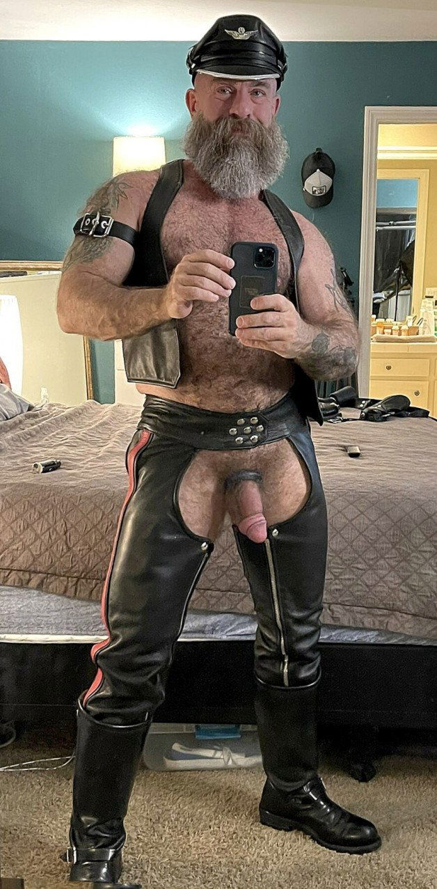 Photo by Nickplus33 with the username @Nickplus33, who is a verified user,  July 5, 2024 at 1:46 AM and the text says '#selfie #daddy #leather #cockring #bush #hairy #beefy #beard'