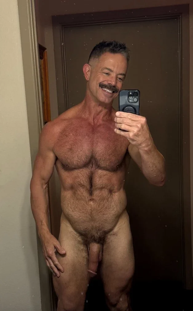 Photo by Nickplus33 with the username @Nickplus33, who is a verified user,  March 28, 2024 at 3:11 AM and the text says '#selfie #daddy #stache #granddaddy #muscled #hairy #trimmed  #hairychest #trimmed  #hung #schlong'