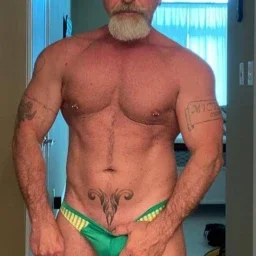 Photo by Nickplus33 with the username @Nickplus33, who is a verified user,  May 7, 2024 at 2:45 AM and the text says '#granddaddy #muscled #toned #trimmed  #beard #ink'