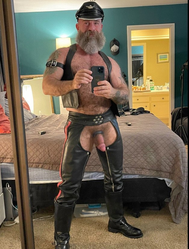 Photo by Nickplus33 with the username @Nickplus33, who is a verified user,  April 25, 2024 at 2:22 AM and the text says '#granddaddy #daddy #beard #leather #hung #thickdick #cockring #hairy #trimmed  #thickdick'