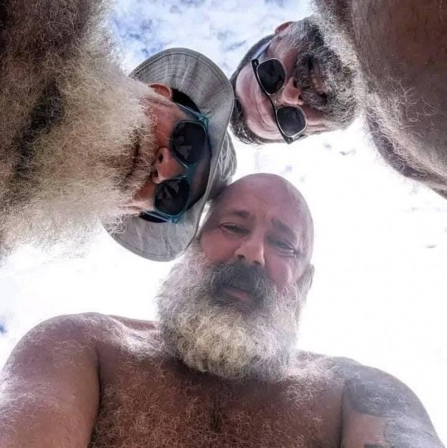 Photo by Nickplus33 with the username @Nickplus33, who is a verified user,  March 11, 2024 at 3:04 AM and the text says '#daddy #granddaddy #shades #outdoors #beard #bear #hairy #beefy'