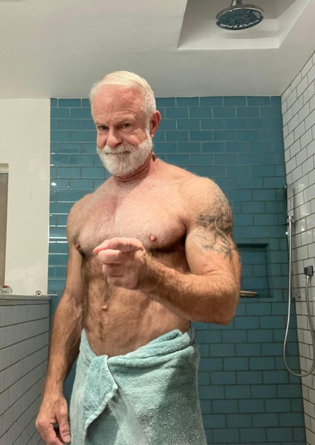 Photo by Nickplus33 with the username @Nickplus33, who is a verified user,  January 17, 2024 at 1:46 AM and the text says '#beard #muscled #ink #granddaddy #hairy #icebear'