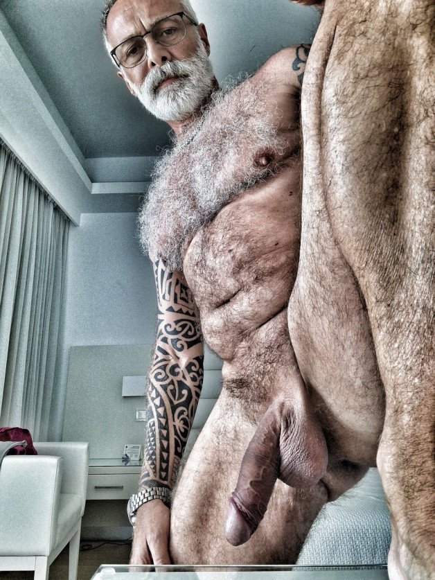 Photo by Nickplus33 with the username @Nickplus33, who is a verified user,  February 4, 2024 at 5:18 AM and the text says '#beard #hairy #specs #hung #thickdick #ink #daddy #granddaddy #toned'