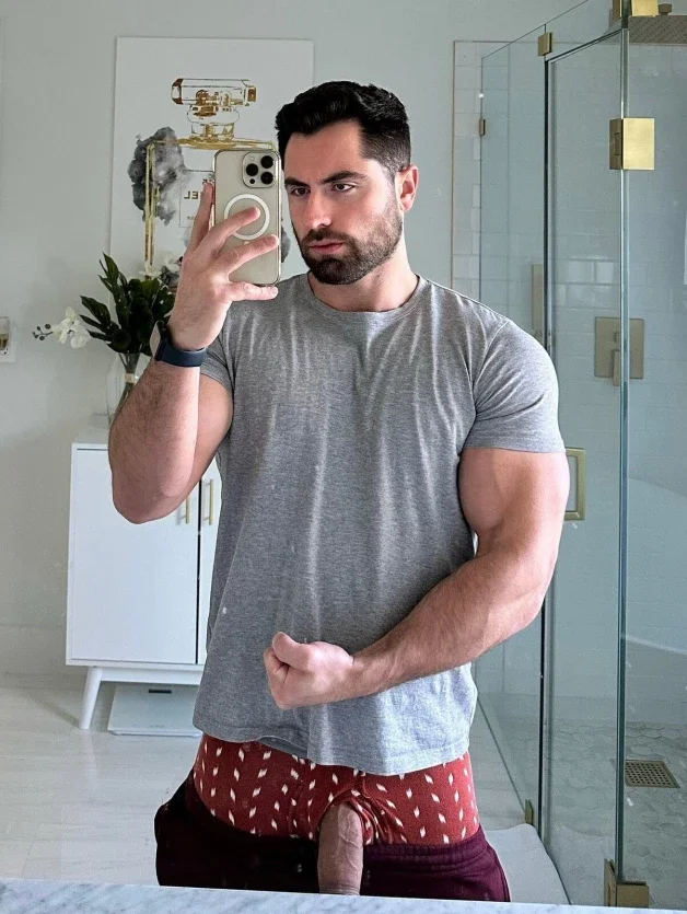Photo by Nickplus33 with the username @Nickplus33, who is a verified user,  May 6, 2024 at 4:35 AM and the text says '#youngdilf #ruggeryvaldivia #hung #reveal #selfie #manspread  #thickdick #obsession #beard'