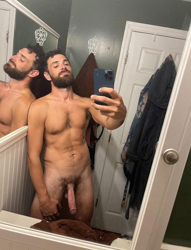 Photo by Nickplus33 with the username @Nickplus33, who is a verified user,  July 5, 2024 at 12:34 AM and the text says '#selfie #beard #hung #longdick #bush #toned  #dilf'