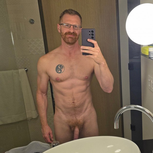 Photo by Nickplus33 with the username @Nickplus33, who is a verified user,  June 30, 2024 at 3:02 AM and the text says '#selfie #specs #dilf #ginger #toned #beard #bush'